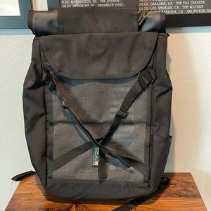 Chrome roll top backpack